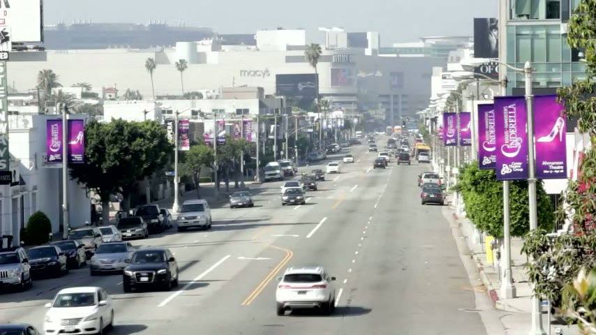 Street-level view of a light pole banner campaign