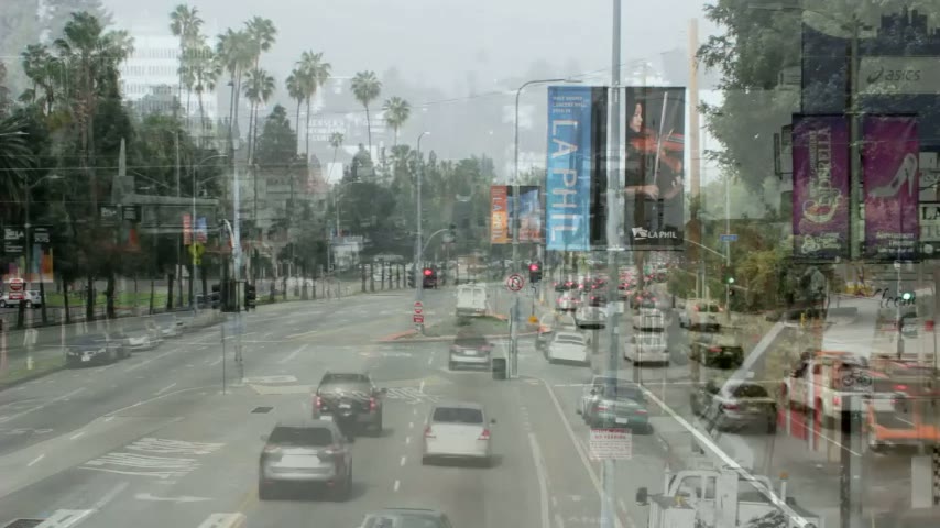 City street lined with light pole banners